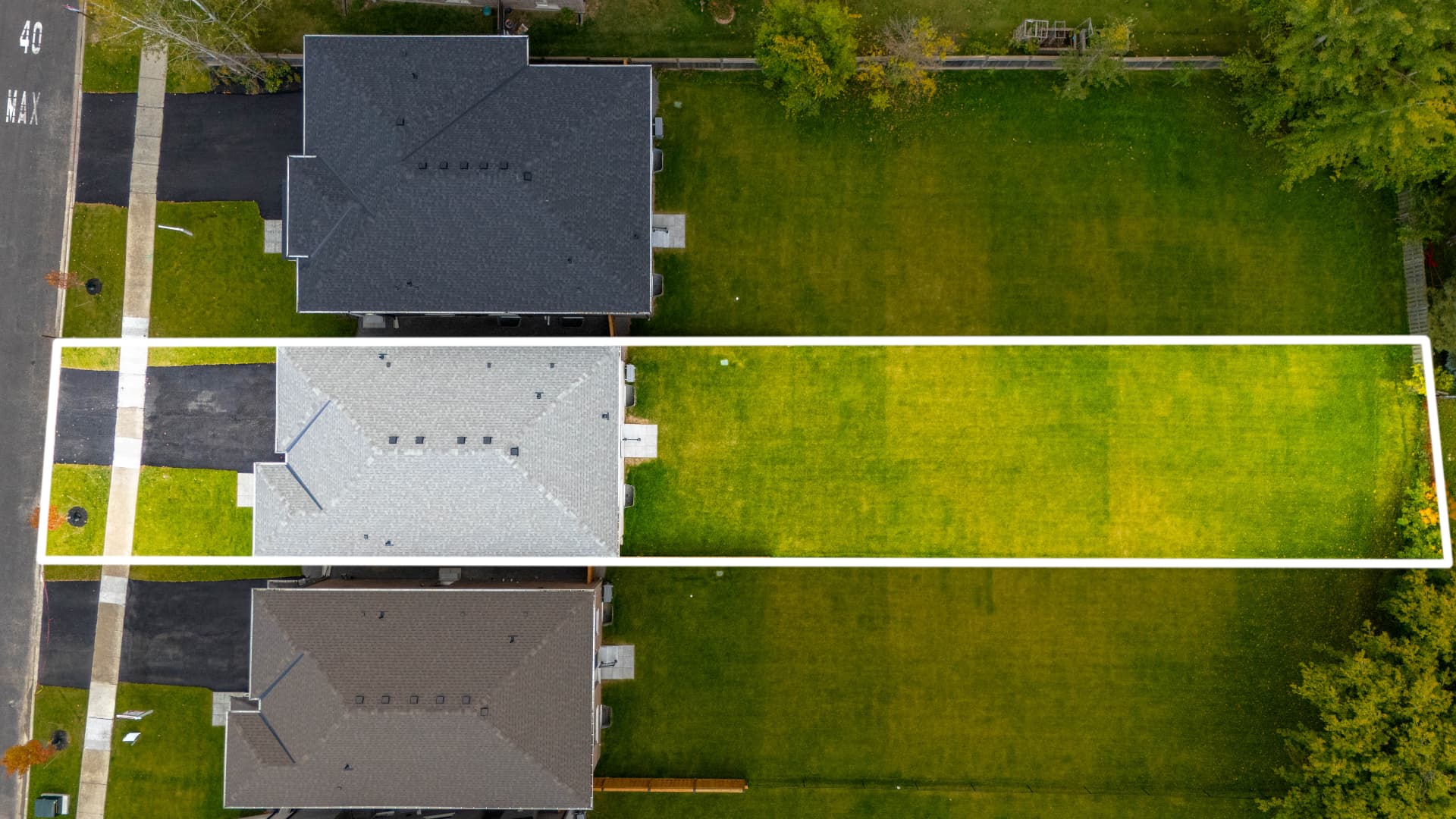 Aerial view of the property and lot